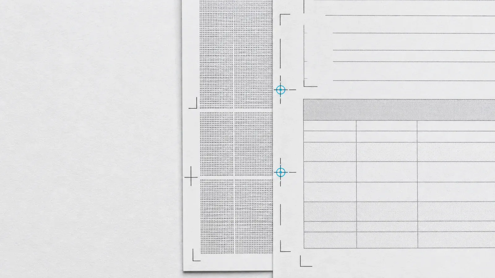 Two printed invoice proofs held in exact register: a human-readable sheet and a machine-data sheet aligned by crop marks.